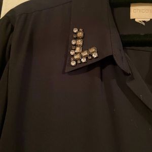 Long blouse witb jeweled detail.